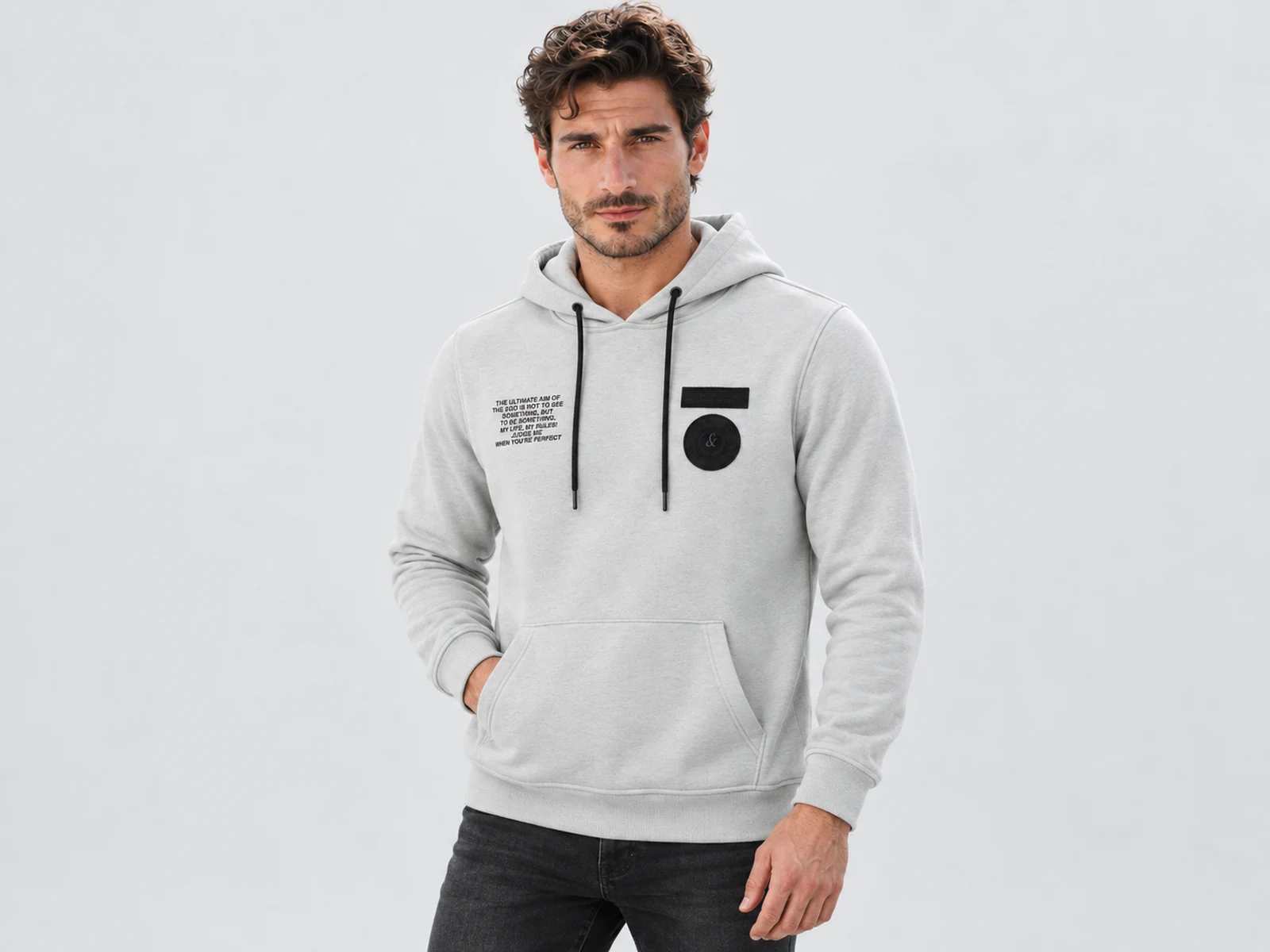 Male model wearing a custom hoodie and tracksuit