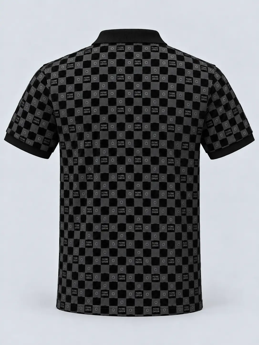 Back of a black flock printed polo shirt with repeating checkered artwork and small motifs, a plain collar and solid sleeve cuffs