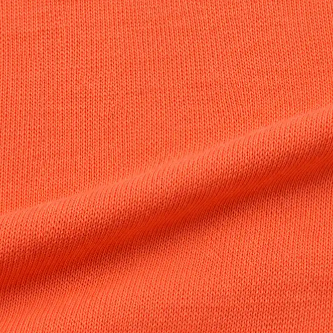 Coral orange single jersey fabric texture for the recycled cotton blend compact jersey development direction