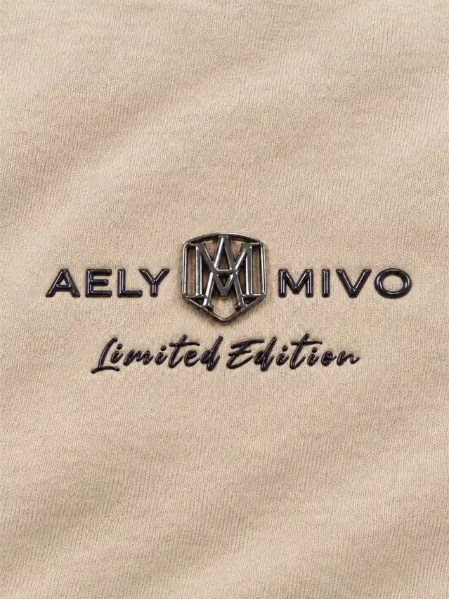 Embossed lettering and molded metal badge detail