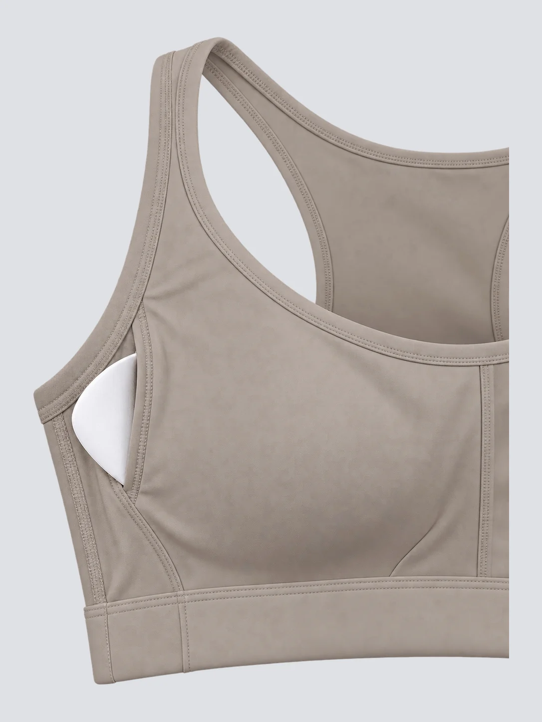 Sports bra lining and removable white cup pad detail